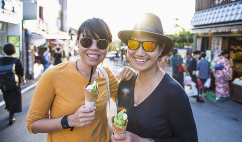 Two friends enjoying matcha ice cream in kyoto