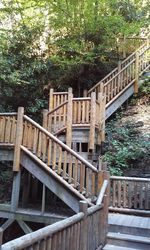 Wooden railing by trees