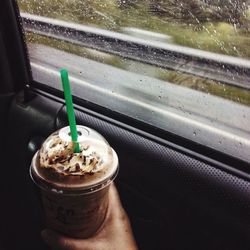 Close-up of car on road