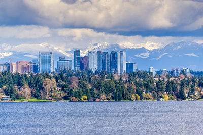 Modern buildings in bellevue, washington with the cascades range in the background.