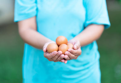 Midsection of man holding ice cream