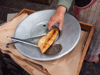 Low section of person preparing food