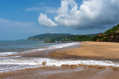 Scenic view of beach against sky