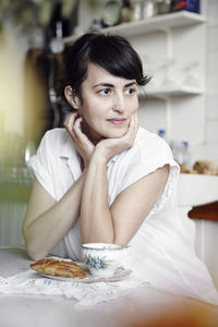 Young woman having tea