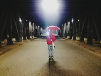 Woman walking in tunnel