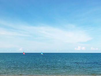 Sailboat in sea against sky