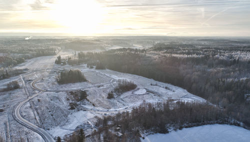 Aerial view of landscape against sky during winter