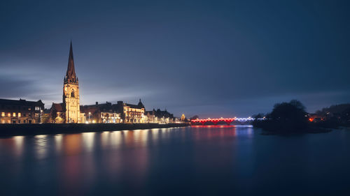 Illuminated buildings in water