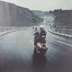 Person riding bicycle on road