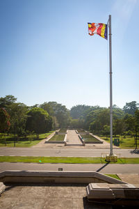 Low angle view of flag flags against clear sky