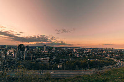 High angle view of buildings against sky during sunset