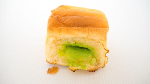 High angle view of bread in plate against white background