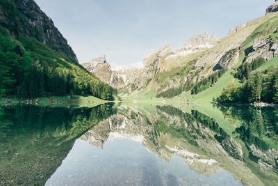 Scenic view of lake with mountains in background