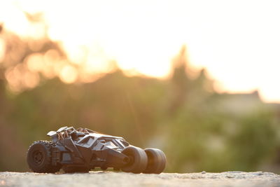 Close-up of toy car on retaining wall