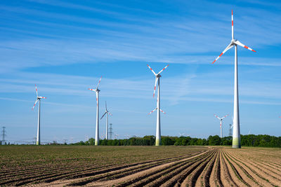 Modern wind turbines in an agricultural area in germany
