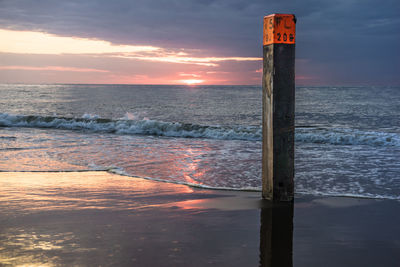 Scenic view of sea against sky at sunset