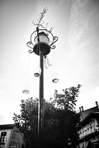 Low angle view of street light against sky