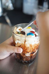 Midsection of person holding ice cream