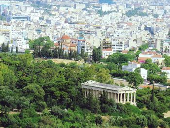 High angle view of trees and buildings in city