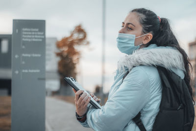 Young woman using mobile phone