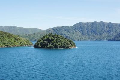 Scenic view of sea against clear blue sky