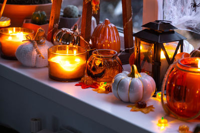 Close-up of illuminated lanterns on table