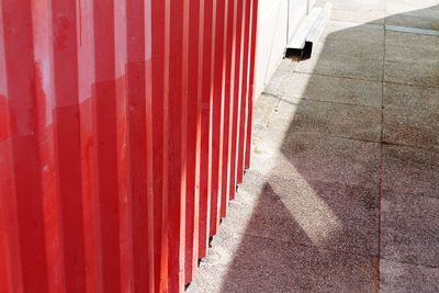 Footpath by closed shutter of store 