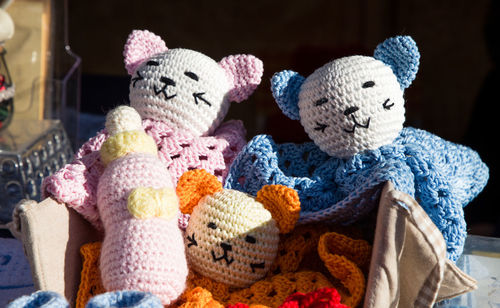 Close-up of knitted toys outdoors