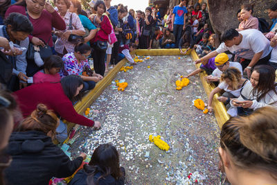 High angle view of people sitting outdoors