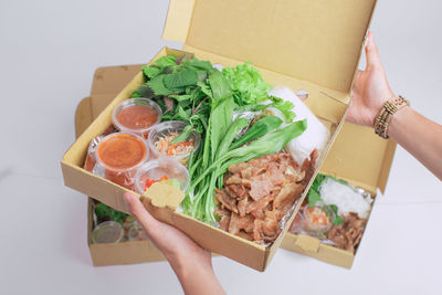 Midsection of woman holding food