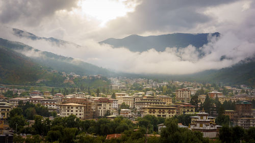 High angle view of buildings in city against sky