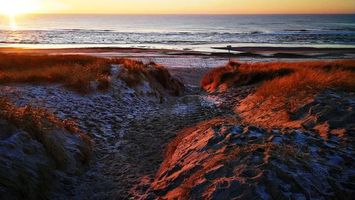 Scenic view of sea against sky during sunset