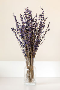 Lavender bouquet in a glass vase. minimalism interior decoration.