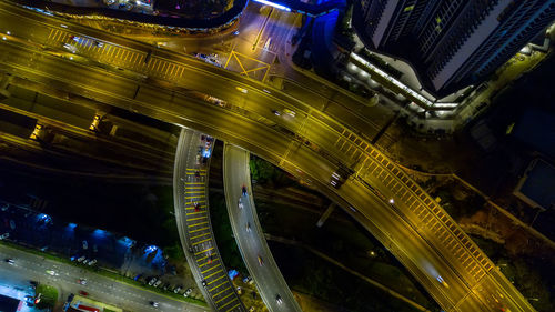 High angle view of city lit up at night