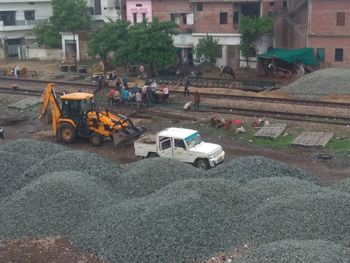 Vehicles on road against buildings in city