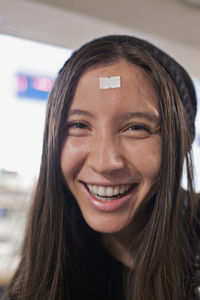 Smiling young woman using a smart phone