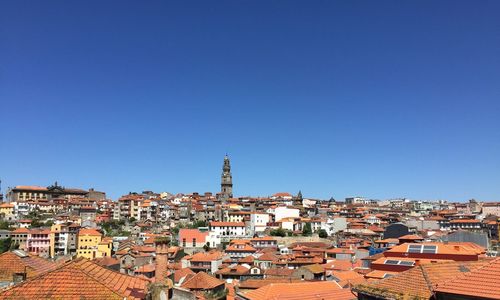 High angle shot of townscape against blue sky