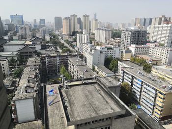 High angle view of buildings in city against sky