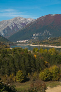 Scenic view of lake and mountains against sky