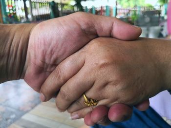Close-up of man holding hands