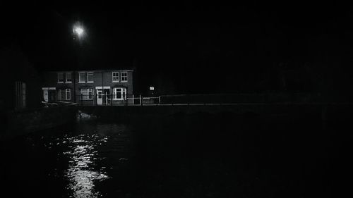 Reflection of illuminated buildings in water at night