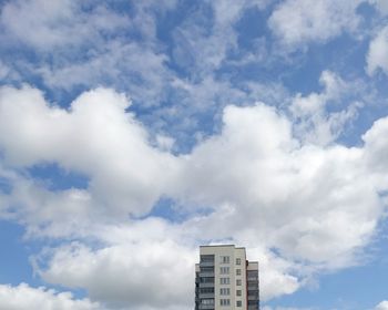 High section of building against cloudy sky