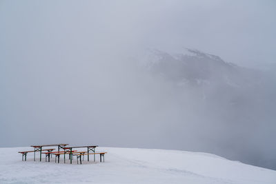 Scenic view of snow covered mountains against sky