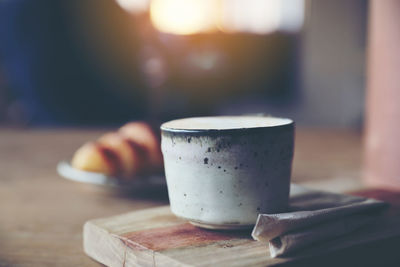 Close-up of coffee cup on table