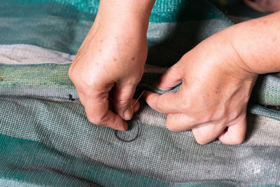 Close-up of man holding hands