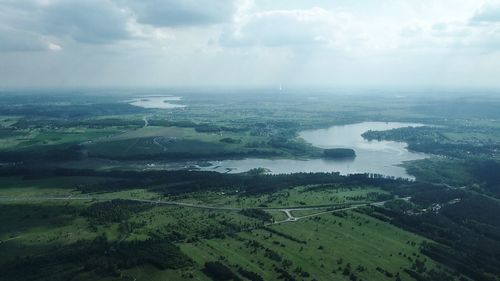 Aerial view of agricultural landscape against sky