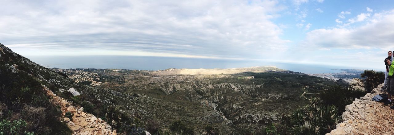 mountain, sky, tranquil scene, tranquility, scenics, beauty in nature, landscape, cloud - sky, mountain range, nature, non-urban scene, cloud, leisure activity, rock - object, cloudy, remote, idyllic, rock formation