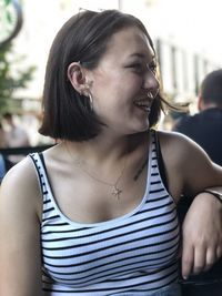 Portrait of beautiful young woman looking away