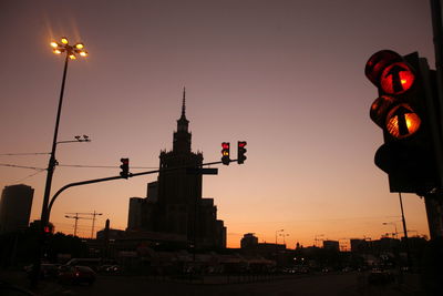 Palace of culture and science against clear sky at sunset