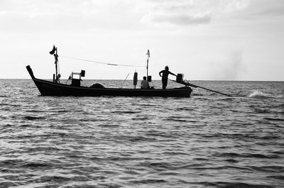 People on boat sailing in sea